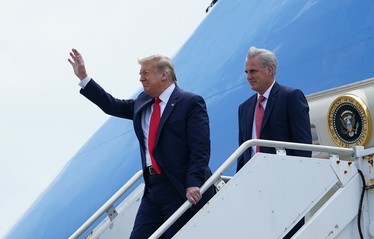 Trump waves as he arrives as US Representative Kevin McCarthy(R-CA) looks on at Cape Canaveral, Florida on May 30, 2020. (AFP)