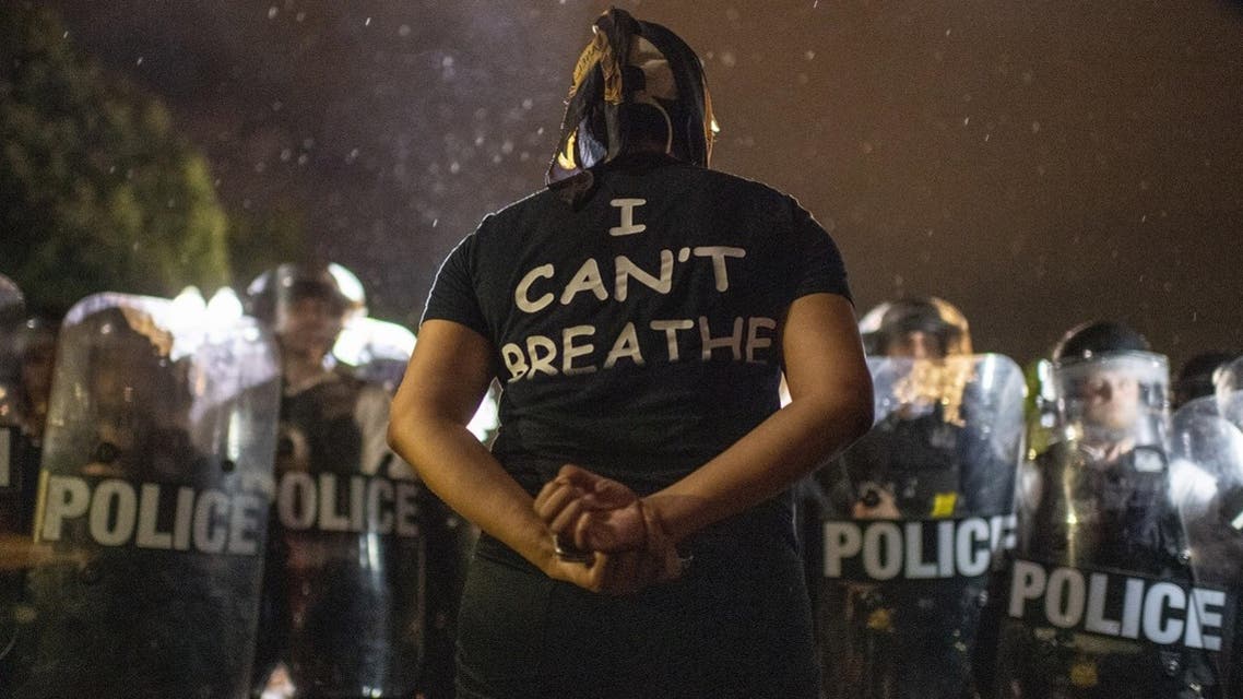 Protesters face off with police outside the White House in Washington, DC, early on May 30, 2020 during a demonstration over the death of George Floyd. (AFP)