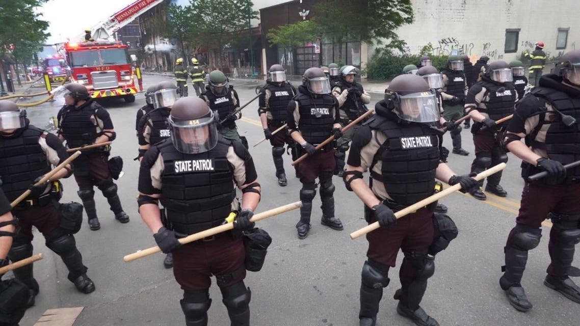 Police secure a perimeter following a night of rioting sparked by the death of George Floyd while in police custody on May 29, 2020 in Minneapolis, Minnesota, US. (AFP)