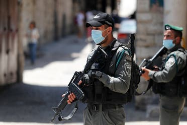 Member of the Israeli security forces patrol in the area where Israeli police in annexed east Jerusalem shot dead a Palestinian with special needs on May 30, 2020. (AFP)