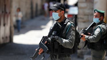 Member of the Israeli security forces patrol in the area where Israeli police in annexed east Jerusalem shot dead a Palestinian with special needs on May 30, 2020. (AFP)