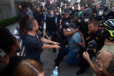Police officers and protesters clash near CNN center, Friday, May 29, 2020 in Atlanta. (AP)