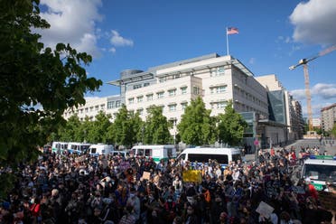 Participants in a rally on May 30, 2020, against the violent death of African-American George Floyd by a white policeman have gathered in front of the US embassy in Berlin. (AP)