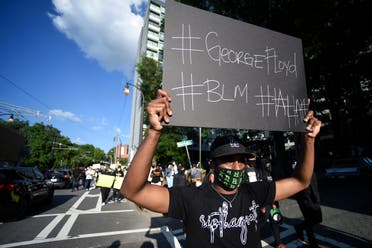 Demonstrators march near Ebenezer Baptist Church, Friday, May 30, 2020 in Atlanta. (AP)