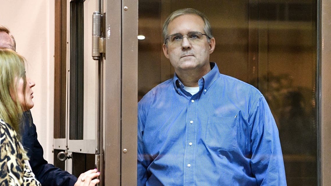 In this file photo taken on January 22, 2019 Paul Whelan, a former US Marine accused of espionage and arrested in Russia, listens to his lawyers while standing inside a defendants' cage during a hearing at a court in Moscow. (AFP)