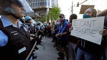 People confront police officers during a protest over the death of George Floyd in Chicago, Saturday, May 30, 2020. (Reuters)
