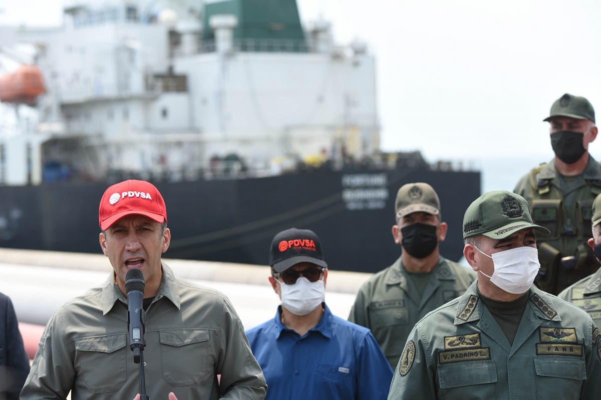 Venezuela’s Industry Minister Tareck El Aissami (L), speaks next to defenSe Minister Vladimir Padrino(R) after the Iranian oil tanker Fortune docked at the El Palito refinery in Puerto Cabello, in the northern state of Carabobo, Venezuela, on May 25, 2020. (AFP)