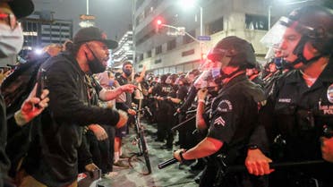 In this May 29, 2020, photo, protesters confront police officers during a protest over the death of George Floyd in Los Angeles. (AP)