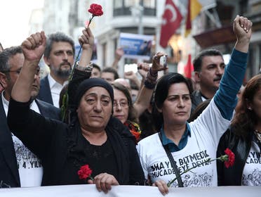 Mothers of Berkin Elvan and Ethem Sarisuluk attend a demonstration to mark the fourth anniversary of the Gezi Park protests in central Istanbul. (Reuters)