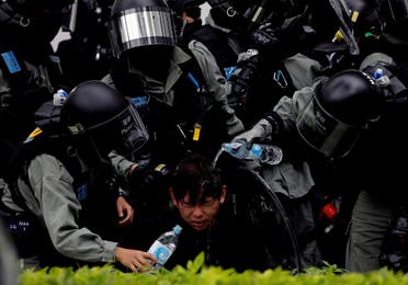 Riot police pour water on the face of anti-government protester at Sheung Shui, a border town in Hong Kong. (File photo: Reuters)