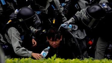 Riot police pour water on the face of anti-government protester after an anti-parallel trading protest at Sheung Shui, a border town in Hong Kong. (File photo: Reuters)