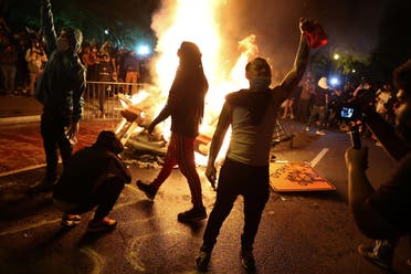 Protesters rally around a bonfire in the midst of protests against the death in Minneapolis police custody of George Floyd near the White House in Washington, U.S. May 31, 2020. (Reuters)