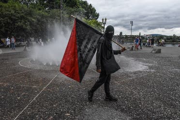 Members of Antifa pass a fountain during an alt-right rally in Portland, Oregon. (File photo: AFP)