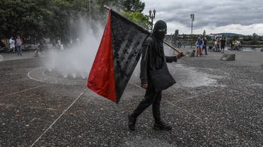 Members of Antifa pass a fountain during an alt-right rally on August 17, 2019 in Portland, Oregon. (File photo: AFP)