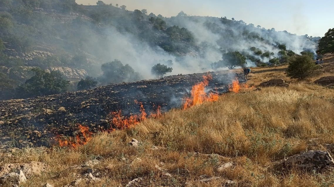 A picture obtained by AFP from Iranian news agency Tasnim on May 30, 2020, shows fires burning in a protected area in the Zagros mountain range, near the city of Behbahan in the Khuzestan province. (AFP)