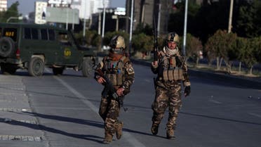 Afghan security forces inspect the site where a bus carrying local TV station employees hit a roadside bomb in Kabul, Afghanistan, Saturday, May 30, 2020. (File photo: AP)