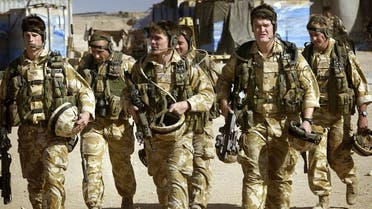 British Royal Marines Commandos attached to the Black Watch battle group prepare for a mission inside camp Dogwood 25 miles south of Baghdad, Iraq 18 November, 2004. (AFP)
