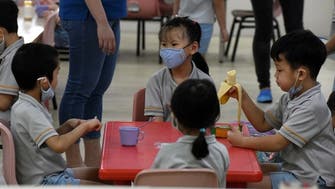 Coronavirus: Students in masks return to schools as Singapore eases restrictions