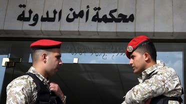 Jordanian security forces stand guard outside a military court as members of a cell accused of involvement in a shooting attack in 2016 go on trial at the military State Security Court in the Jordanian capital of Amman on November 13, 2018. (AFP)