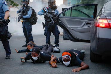 Motorists are ordered to the ground from their vehicle by police during a protest on South Washington Street, on May 31, 2020, in Minneapolis. (AP)