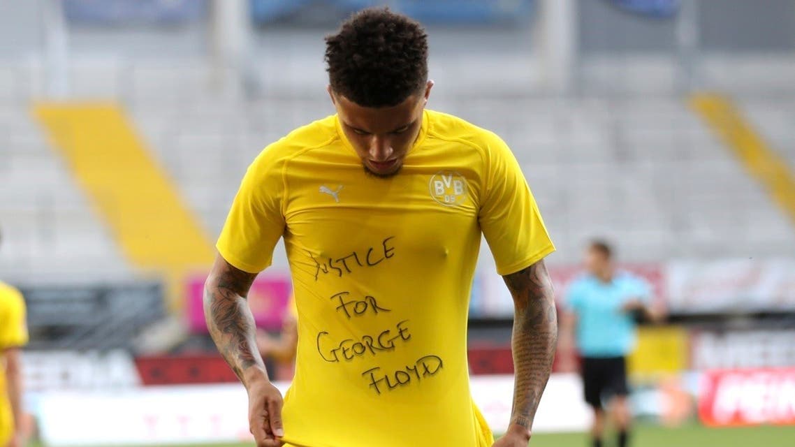 Jadon Sancho displaying a T-shirt emblazoned with “Justice for George Floyd.” (AP)
