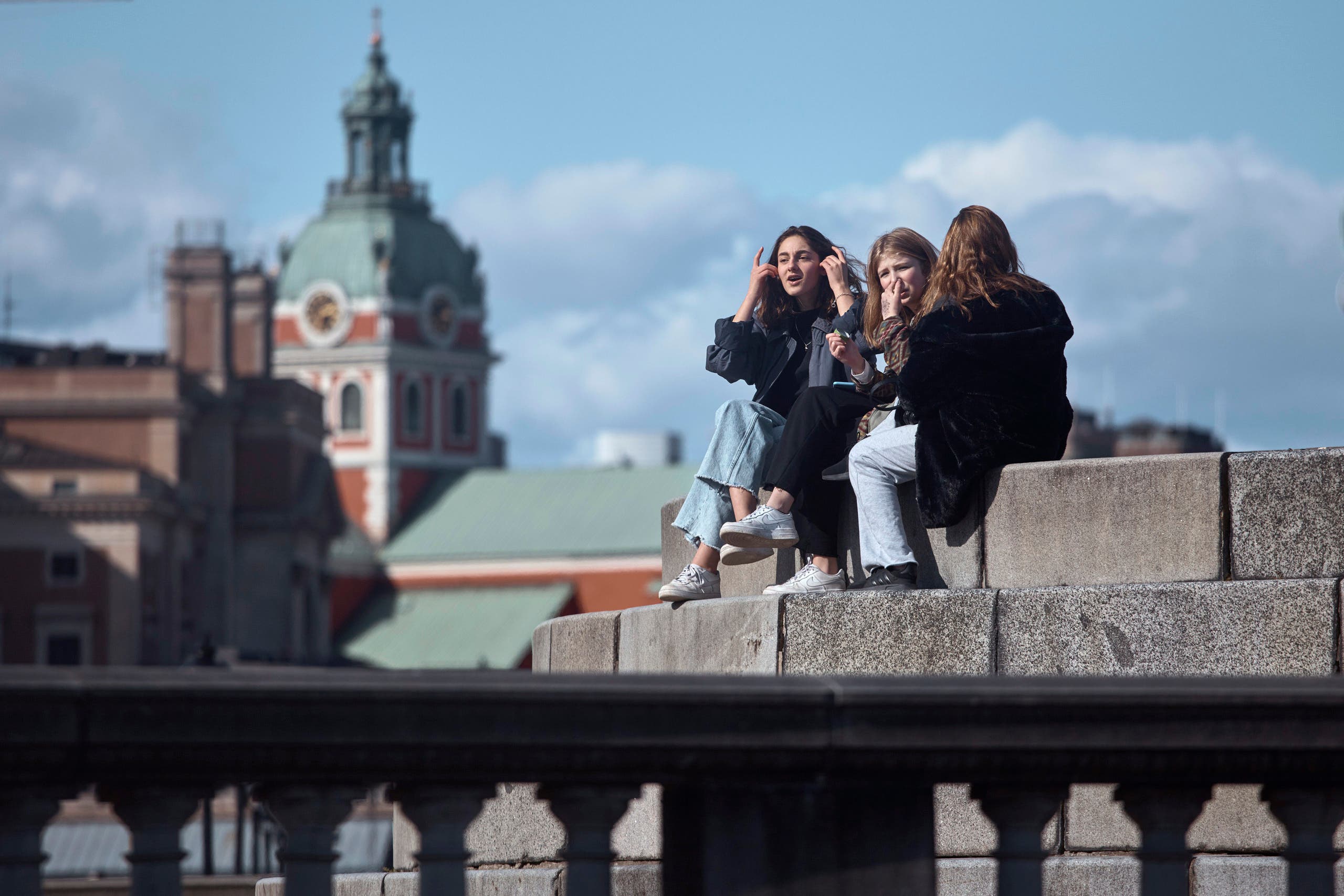 Young people socialise together in Stockholm, Sweden, Saturday, April 4, 2020. (AP)
