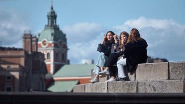Young people socialise together in Stockholm, Sweden, Saturday, April 4, 2020. (AP)
