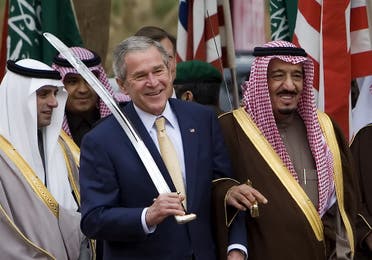 US President George W. Bush dances with a sword with Prince Salman bin Abdul Aziz (R), the brother of the Saudi king and Governor of Riyadh AFP