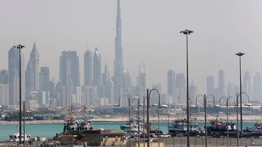 The skyline is seen with the Burj Khalifa as ships dock at Port Rashid, in Dubai May 26, 2013. (Reuters)