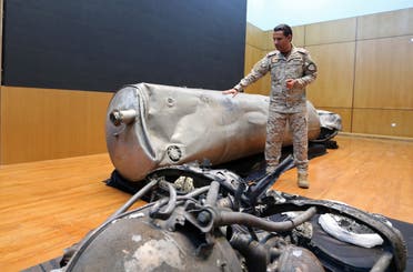Arab Coalition spokesman Colonel Turki al-Malki displays the debris of a ballistic missile launched by the Houthis towards the capital Riyadh, during a news conference in Riyadh, Saudi Arabia on March 29, 2020. (Reuters)