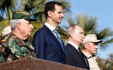 Assad with Putin during a recent visit.