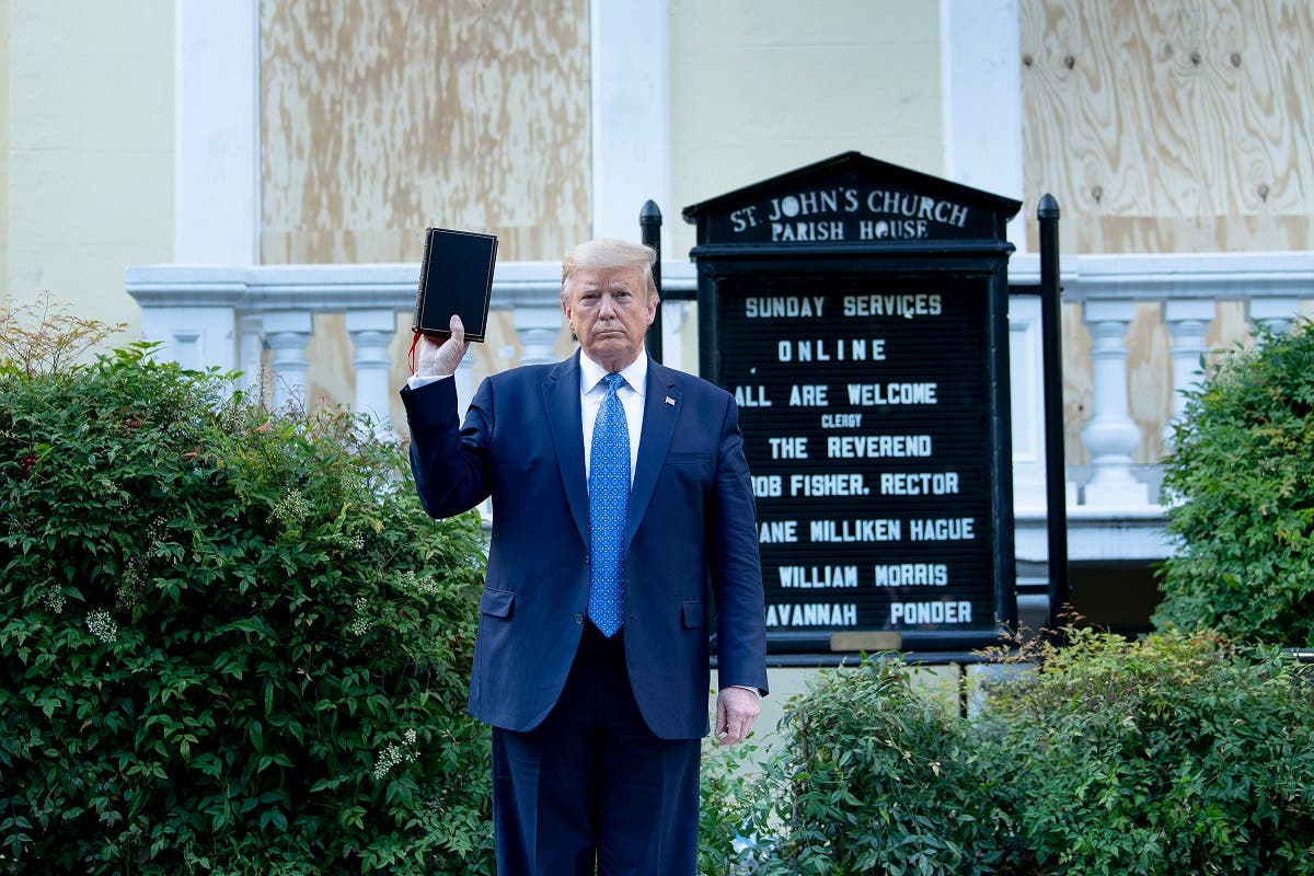 Trump holds a Bible while visiting St. John’s Church across from the White House after the area was cleared of protesters on June 1, 2020, in Washington, DC. (AFP)