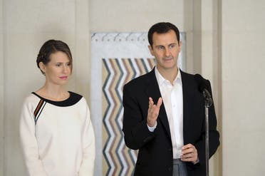 Syria's President Bashar al-Assad stands next to his wife Asma on March 21, 2016. (File photo: Reuters)
