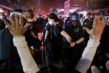 Police arrest protesters as they march through the streets of Manhattan, New York, on June 3, 2020. (AP)