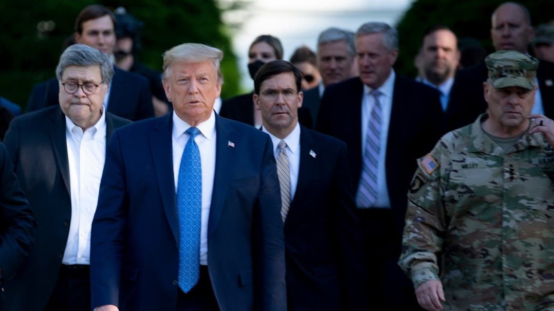 US President Trump and Secretary of Defense Mark Esper (C) walk to visit St. John’s Church, June 1, 2020. (AFP)