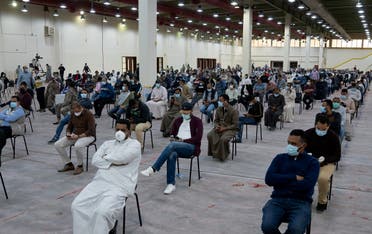 Expatriates wait for mandatory coronavirus testing in a makeshift testing centre in Mishref, Kuwait March 14, 2020.(Reuters)