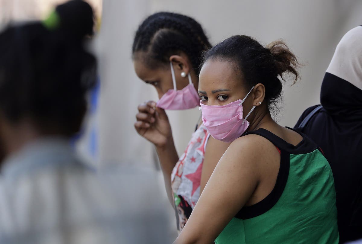 Ethiopian domestic workers wait outside their country’s consulate to register for repatriation, in Hazmieh suburb of the Lebanese capital Beirut on May 18, 2020. (AFP)