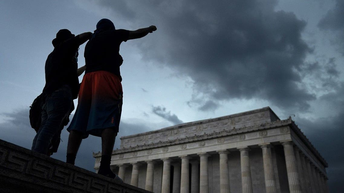Demonstrators peacefully protest against police brutality and the death of George Floyd at the Lincoln Memorial, on June 4, 2020 in Washington, DC. (AFP)