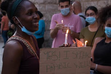 A black Lebanese woman attends a vigil for George Floyd in Beirut, Lebanon. (Nicholas Frakes)
