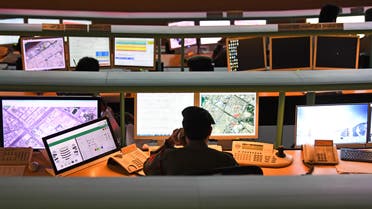 Police officers monitor the streets and receive calls from citizens at the Command and Control Center of Dubai Police in the Gulf emirate. (AFP)
