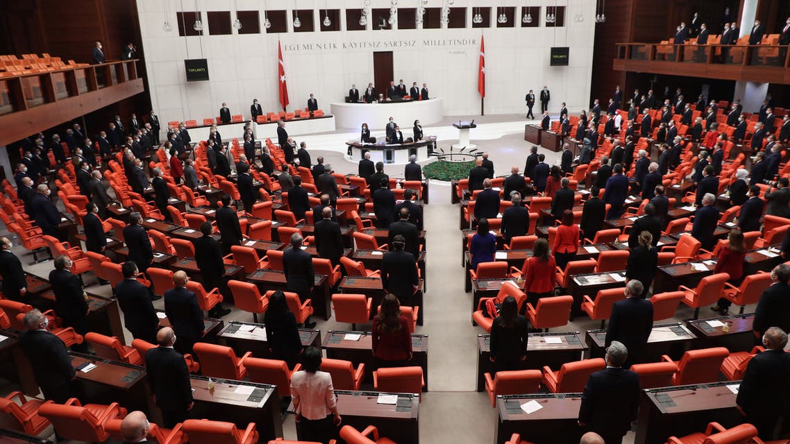 General view of Turkish MPs wearing a protective facemask as a preventive measure against the spread of the COVID-19 (novel coronavirus), as Turkish Parliament Speaker Mustafa Sentop (C) speaks during a special session at the Grand National Assembly of Turkey in Ankara on April 23, 2020, to celebrate the 100th anniversary of the foundation of the Parliament, as well as the National Sovereignty and Children’s Day.