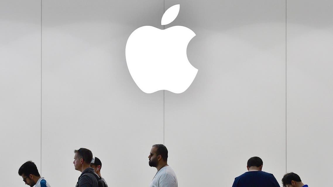 Customers stand in line to purchase the new Apple iPhone 8 at Dubai Mall Apple Store in Dubai, on September 23, 2017. (AFP)