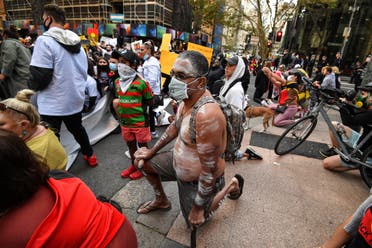 A man in aboriginal dress takes the knee in solidarity with Black Lives Matter protests, Sydney, Australia, June 6, 2020. (AFP)