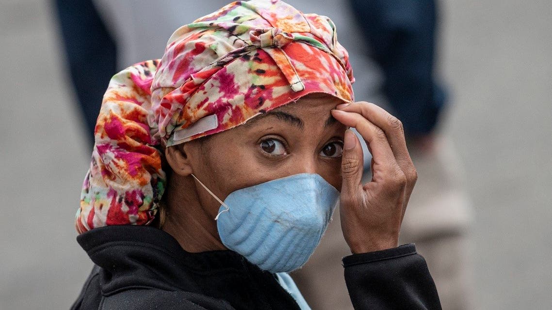A health care workers listens to New York City Mayor Bill De Blasio at a temporary hospital located at the USTA Billie Jean King National Tennis Center. (File photo: AFP)