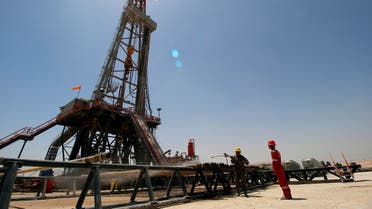 Men work at Rumaila oilfield in Basra, Iraq, May 11, 2017. (Reuters)