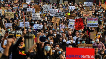 Demonstrators attend a Black Lives Matter protest to express solidarity with US protestors in Sydney on June 6, 2020 and demand an end to frequent Aboriginal deaths in custody in Australia. (AFP)
