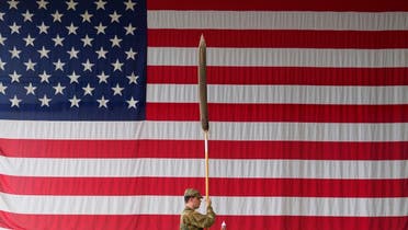 A US soldier holds up a flag during a military ceremony at the Storck barracks in Illesheim, Germany. (File photo: AP)