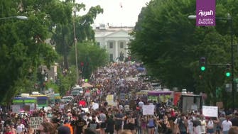 Watch: Thousands march on White House to protest violence by US police