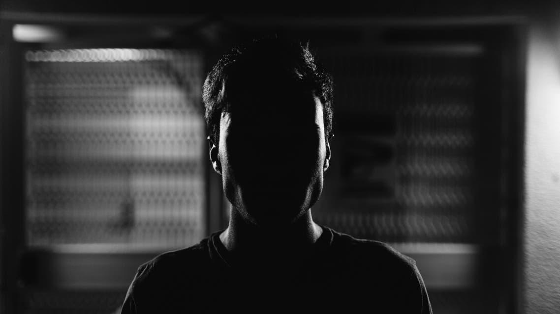 A shadow obscures a man's face. (File photo: Unsplash/Mark Earnest)