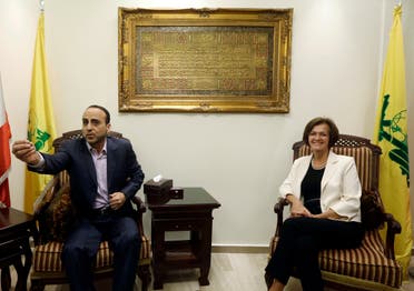Ammar al-Moussawi, then head of Hezbollah's foreign relations department, left, with EU ambassador to Lebanon Angelina Eichhorst, right, in the southern suburb of Beirut on July 25, 2013. (File photo: AP)